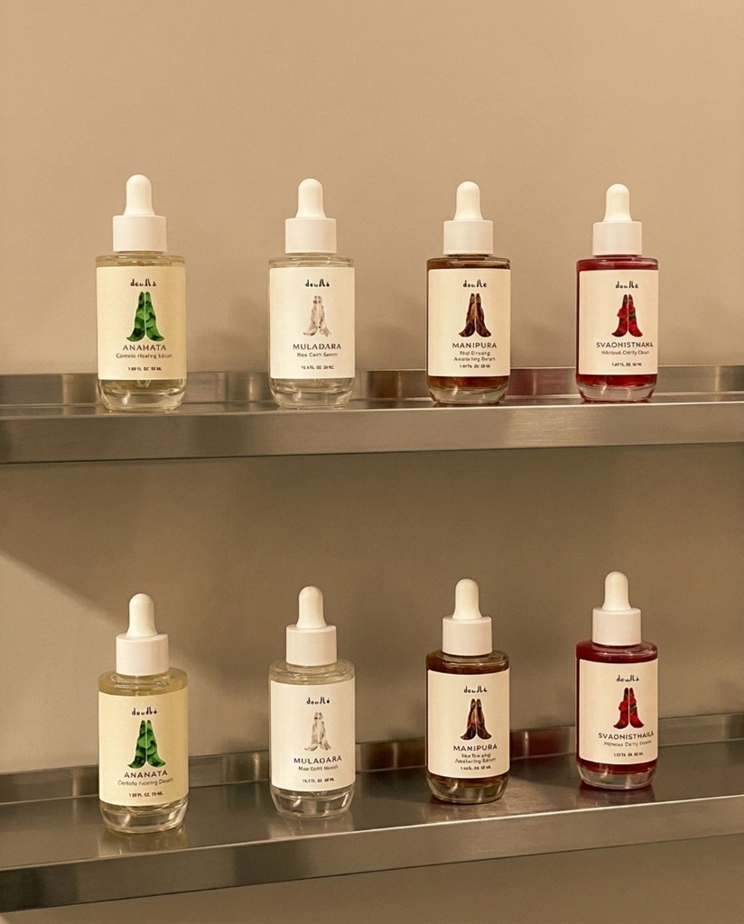 A line of Deullé serum dropper bottles arranged on a shelf